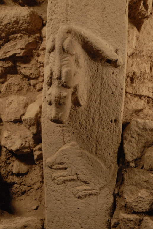 Pillar 27 in Enclosure C, detail of predator in high relief and boar in low relief (Photo D. Johannes, copyright DAI).